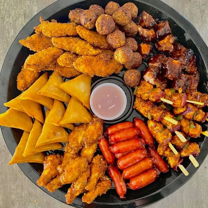 A meaty platter of chicken strips, meatballs, ribs, kebabs, cocktail sausages and wings